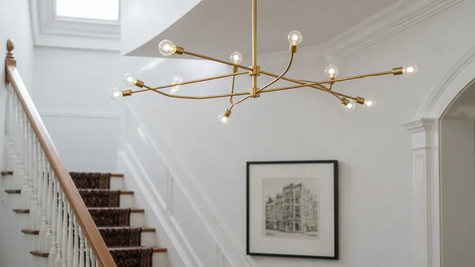 multi arm modern fixture spreading small bulbs across a ceiling