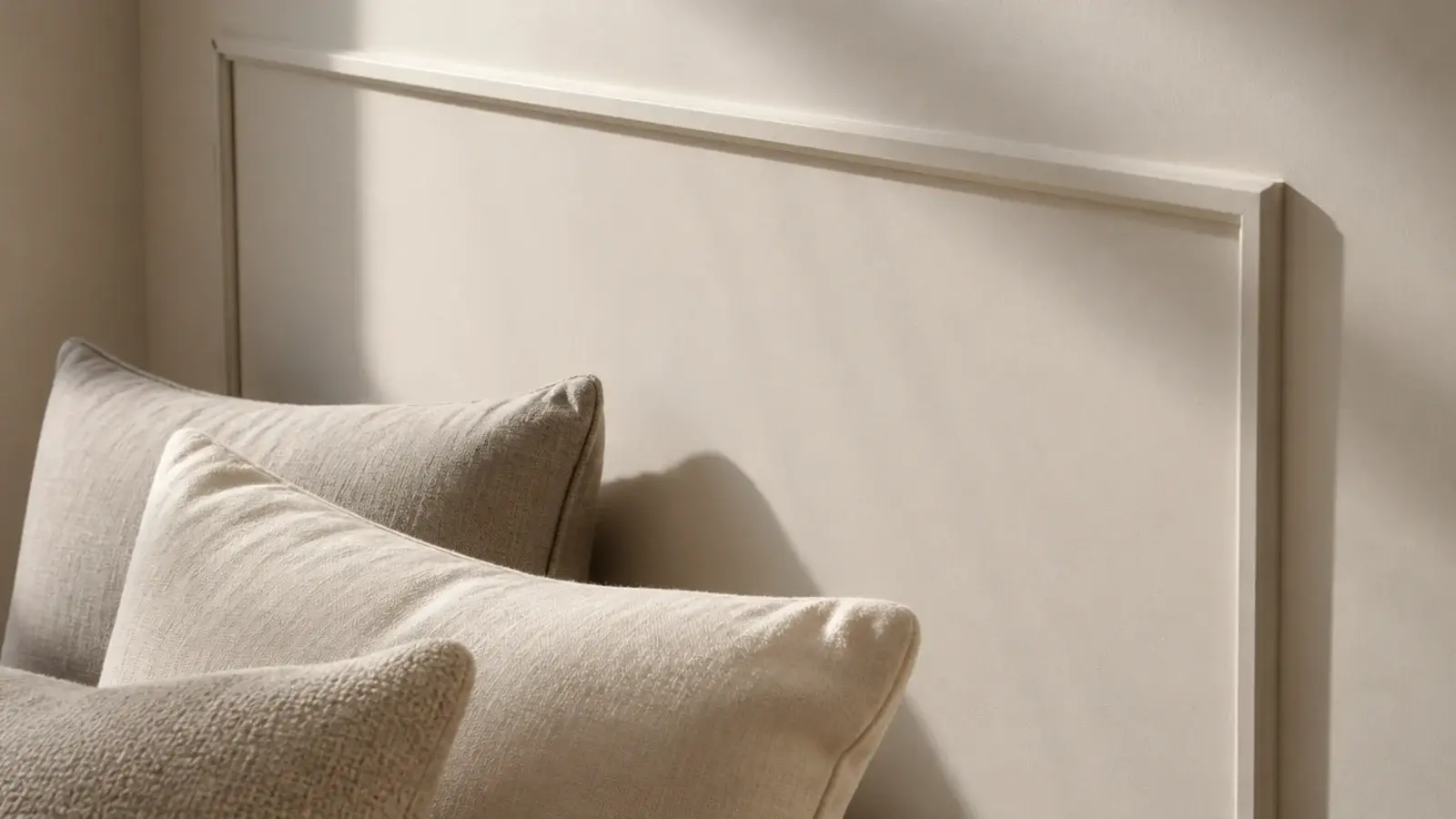 slim applied moulding rectangle painted the wall colour behind a bed