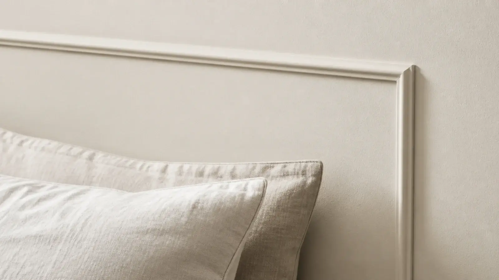 applied picture frame moulding rectangle painted the wall colour behind a bed