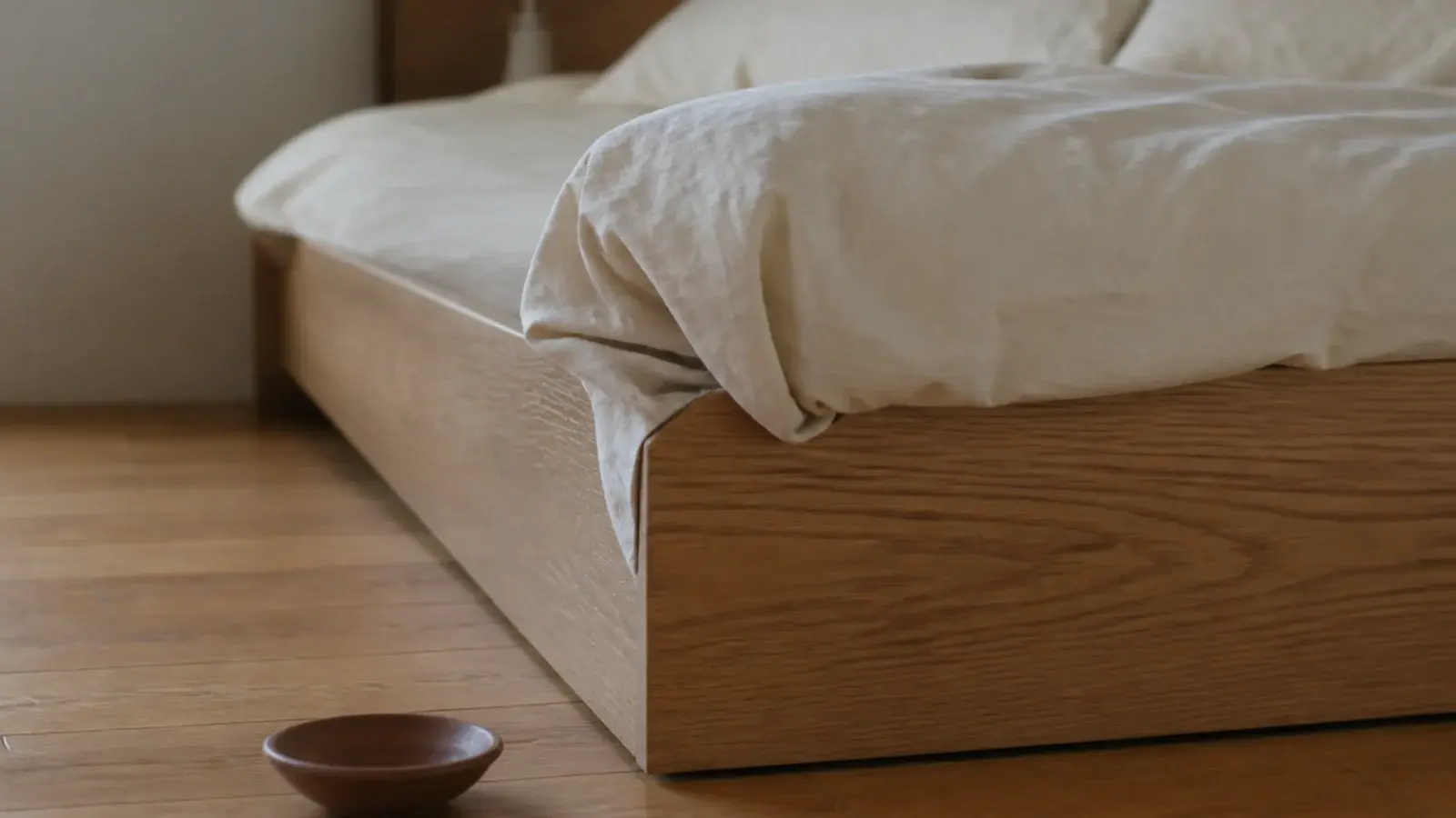 duvet bunching in front of a headboard set flush to the mattress