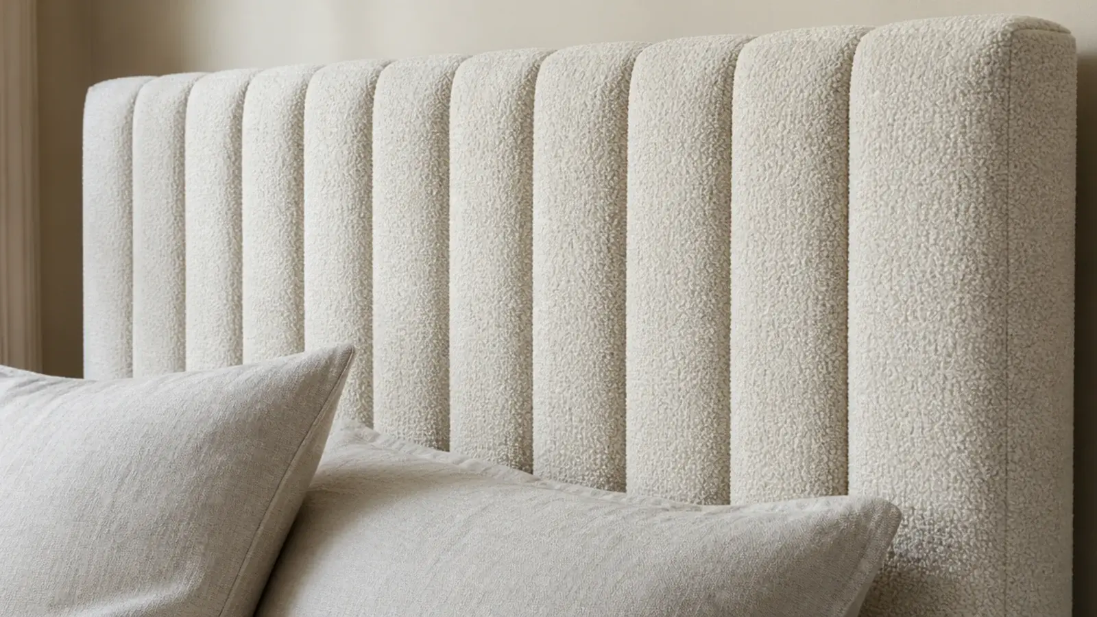 tightly channelled upholstered headboard with narrow even vertical ribs
