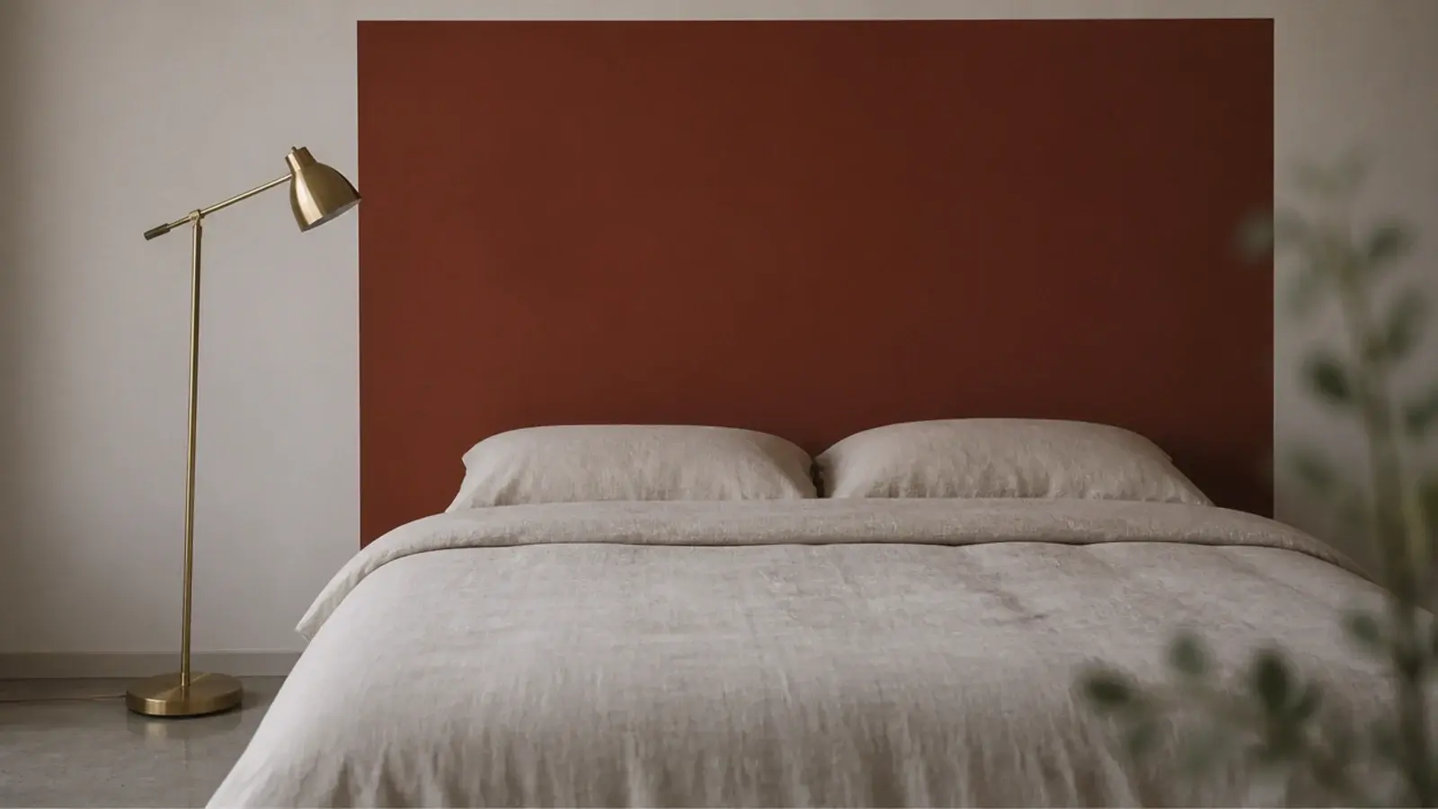 large flat painted block of colour behind a bed with no panel at all