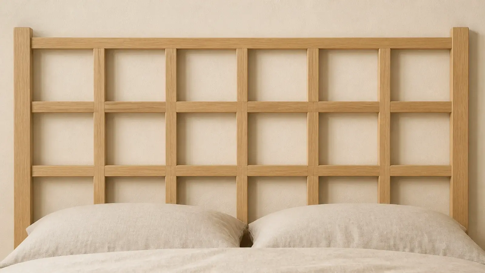 half lap wooden grid headboard forming even squares against a cream wall