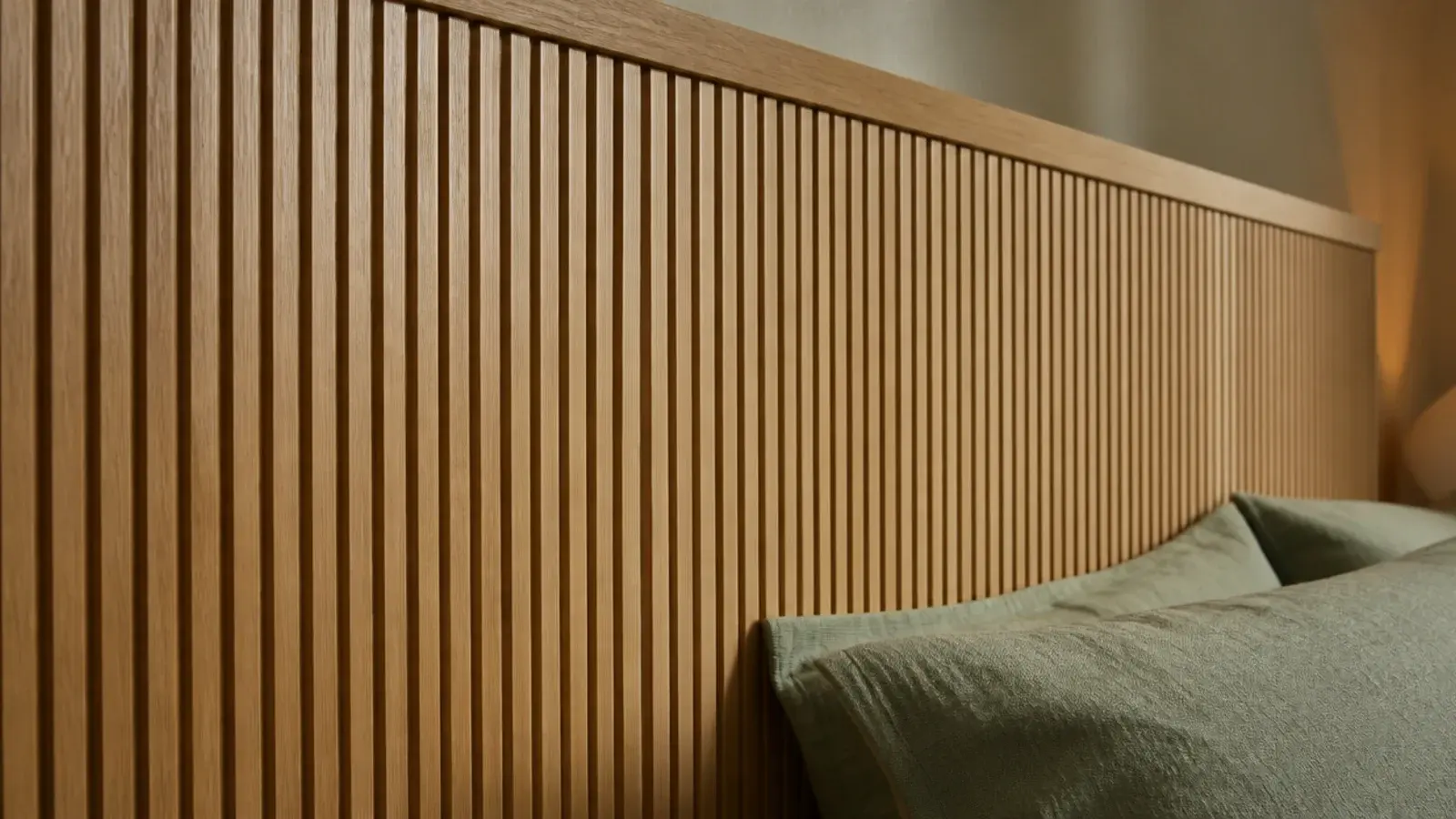 fluted wood headboard panel with evenly routed vertical grooves in oak veneer