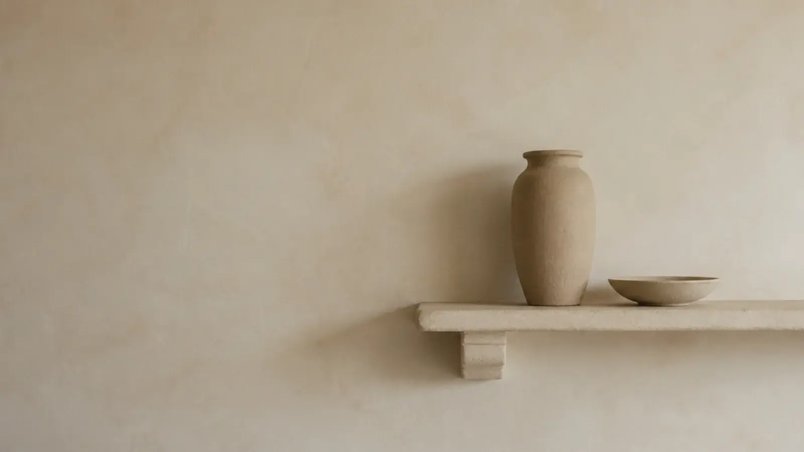 single off centre shelf on a large empty modern kitchen wall