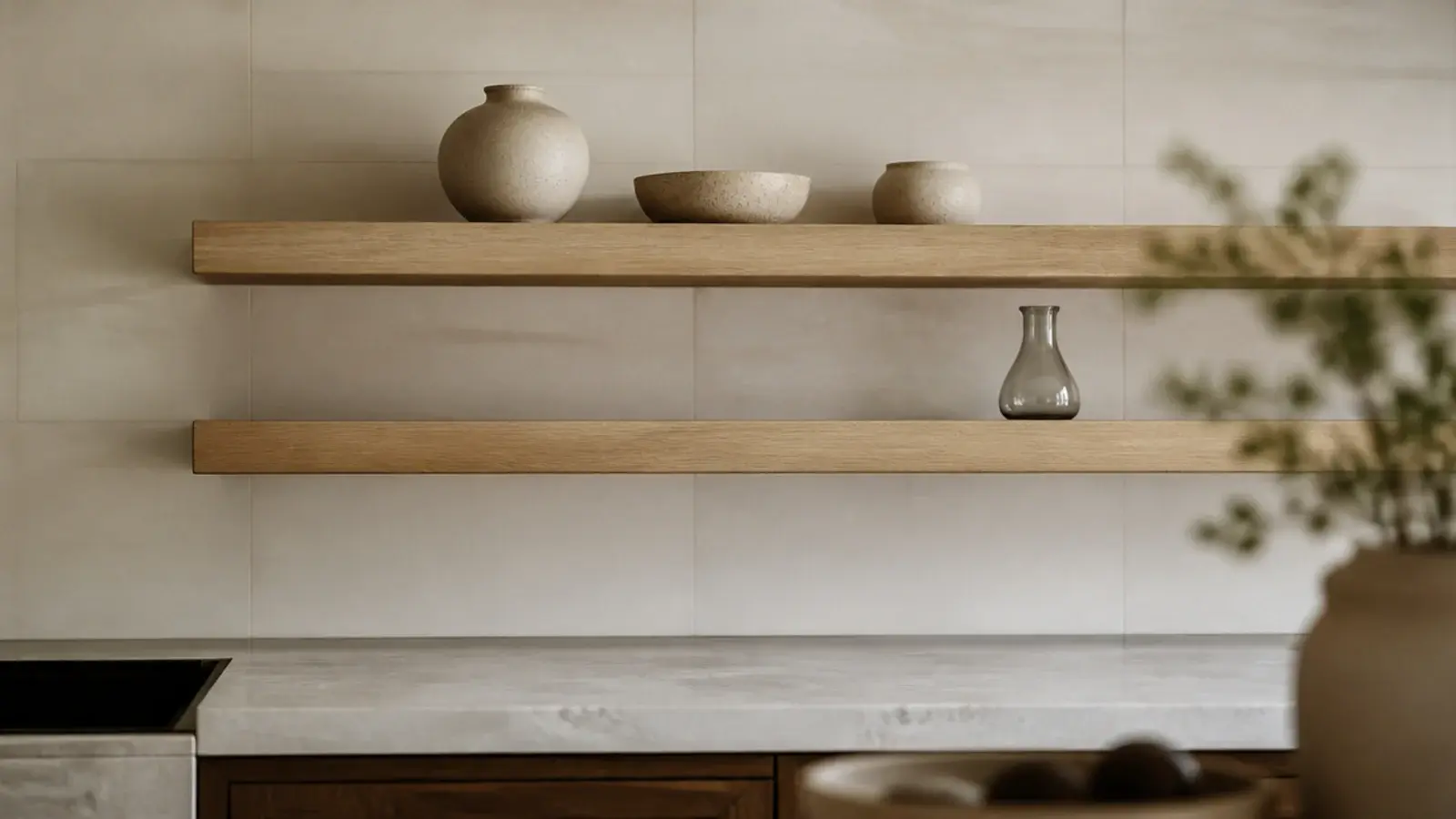 modern kitchen shelves in pale oak floating above a stone counter and tile