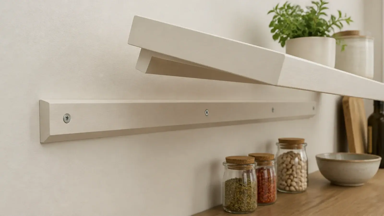 french cleat rail supporting a removable open kitchen shelf on a wall