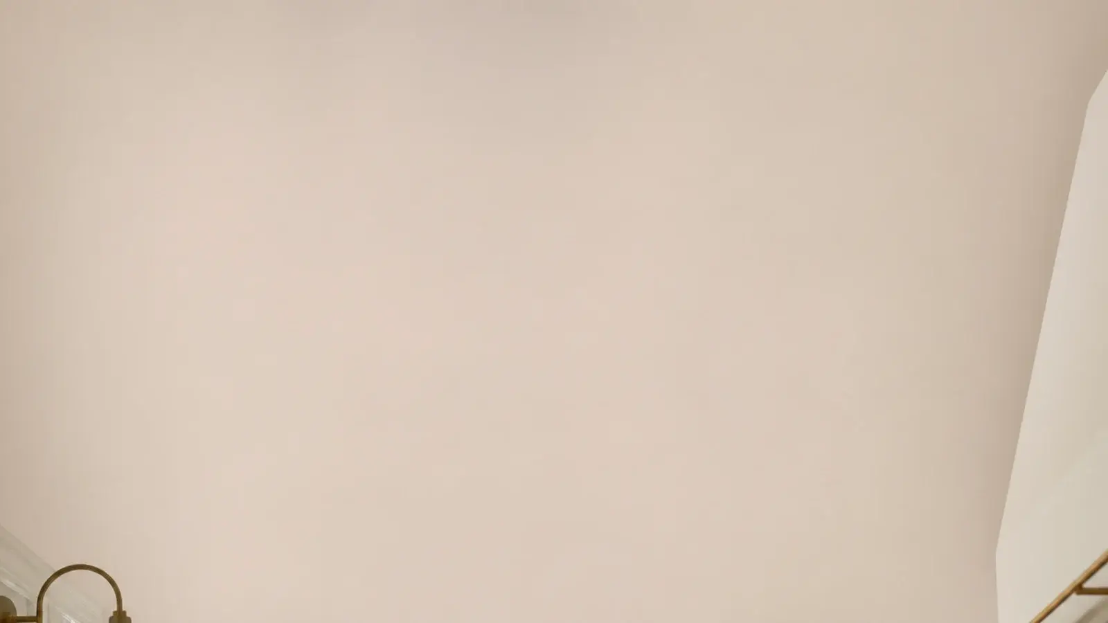 vertical view of small kitchen shelves fitted into narrow strips of wall