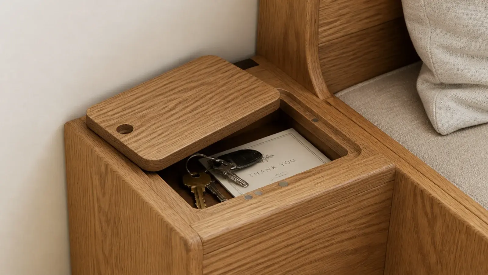 small lidded tray recessed into the top of a timber entry bench