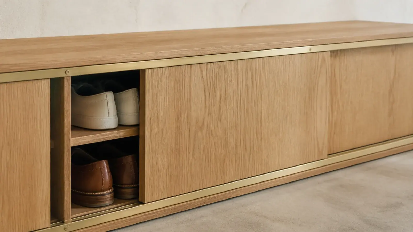 sliding timber doors on a shoe cabinet in a very tight entryway