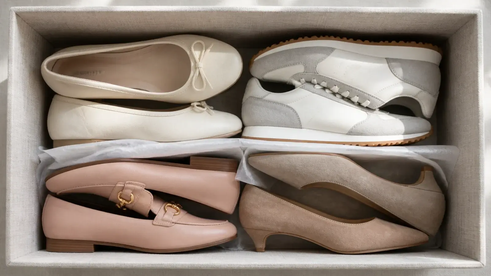 pairs of shoes nested toe to heel inside a storage box