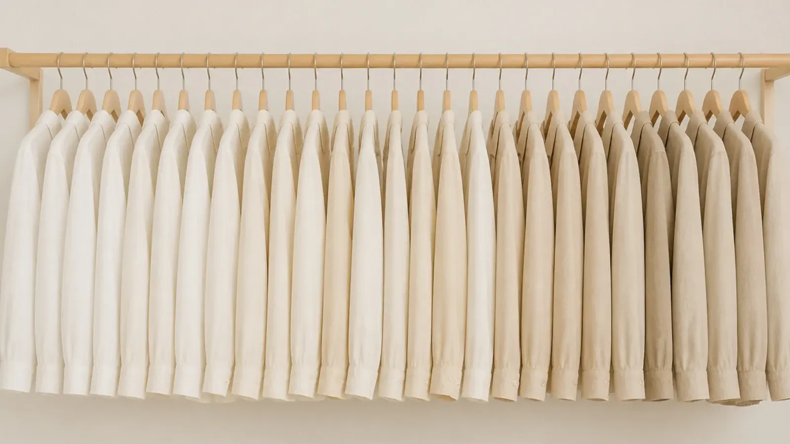 uniform slim hangers replacing mismatched ones on a closet rail