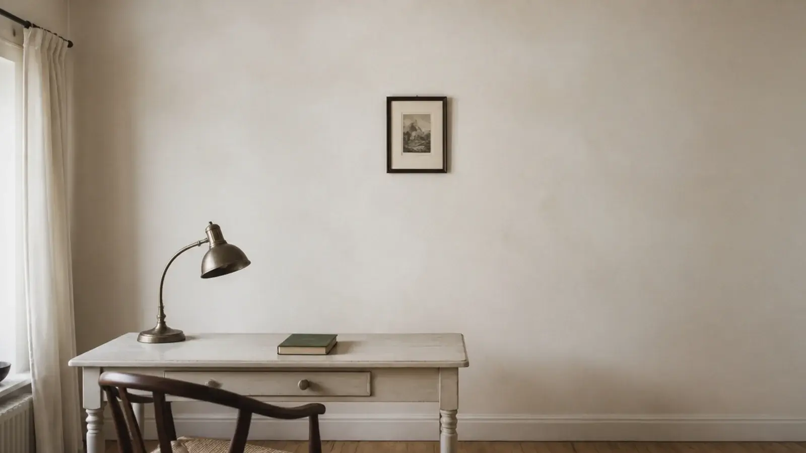 one small framed print alone on a wide bare study wall