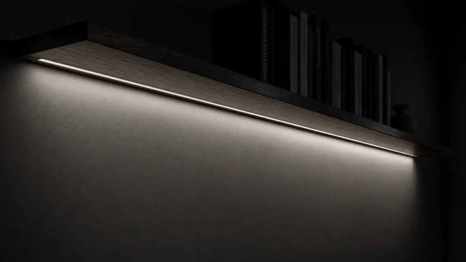 straight run of neutral led light hidden under a floating shelf