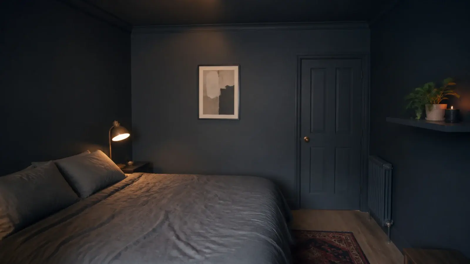 small bedroom painted one deep tone across walls trim and ceiling