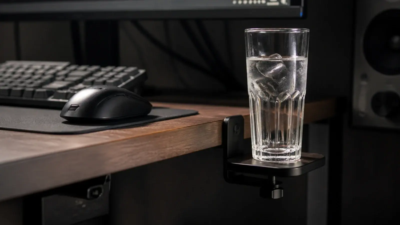 drink standing on a small side shelf below the level of a keyboard