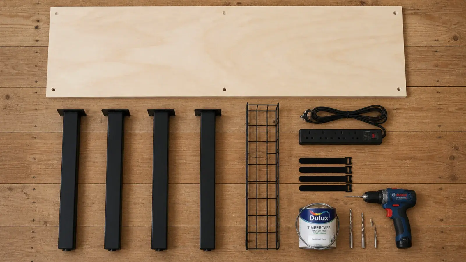 timber board steel legs cable tray and surge lead laid out on a floor