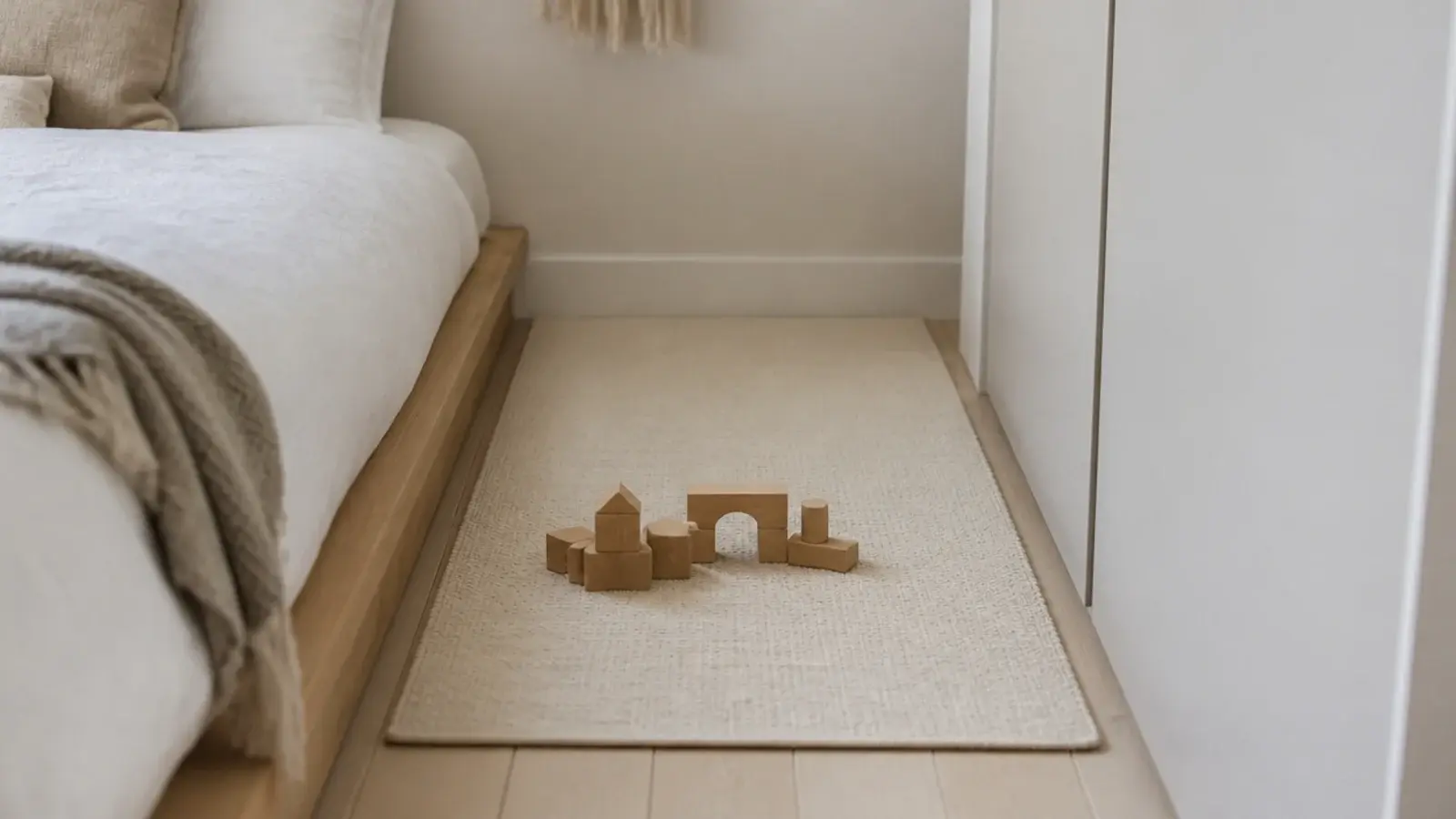 small flatweave rug filling the clear floor between bed and wardrobe