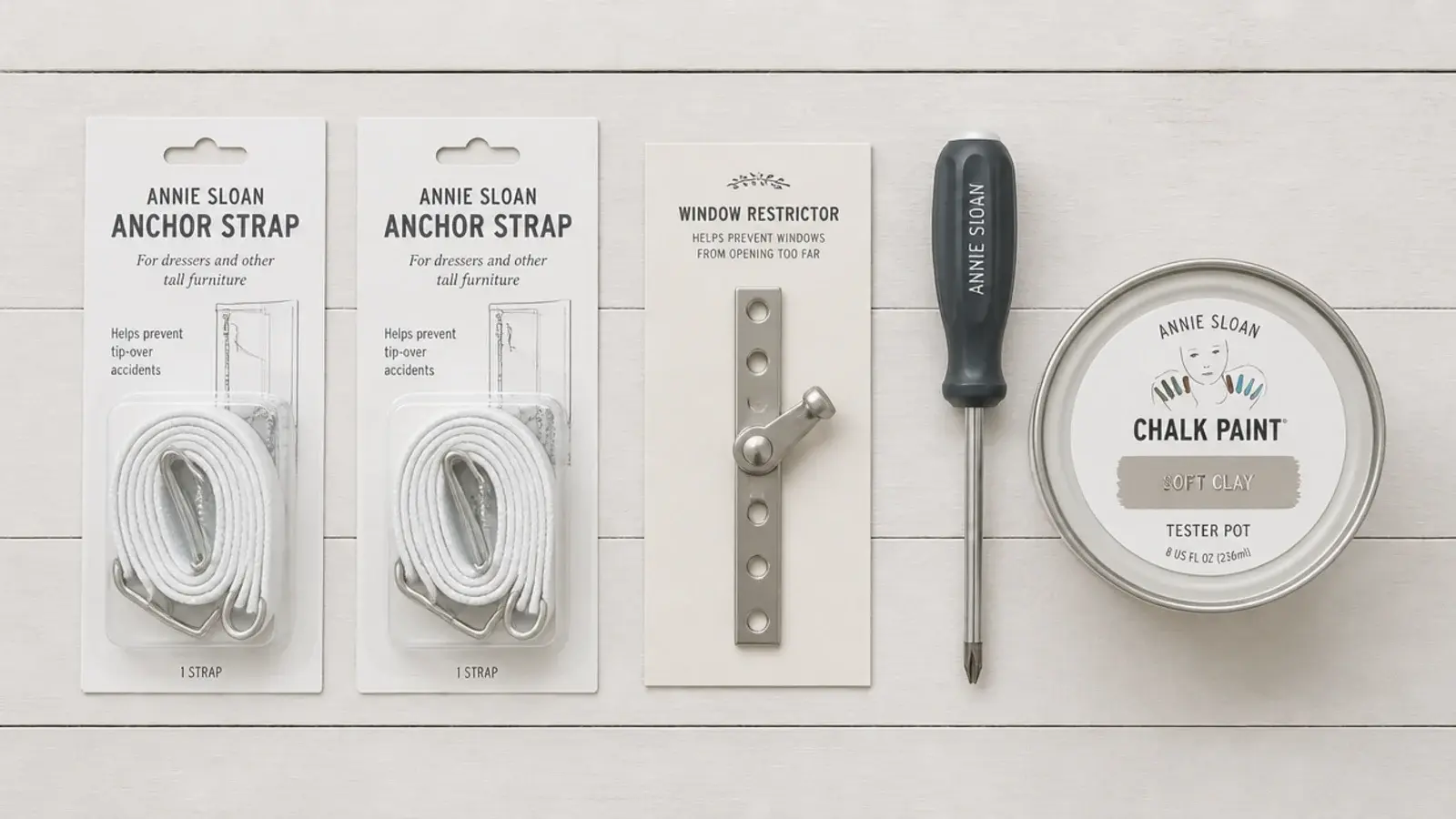 flat lay of anchor straps window restrictor and a paint tester pot