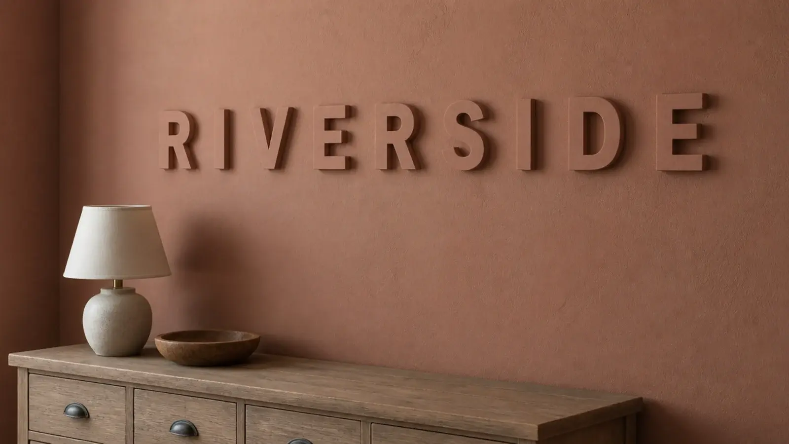 wooden letters painted to match the wall spelling a short name