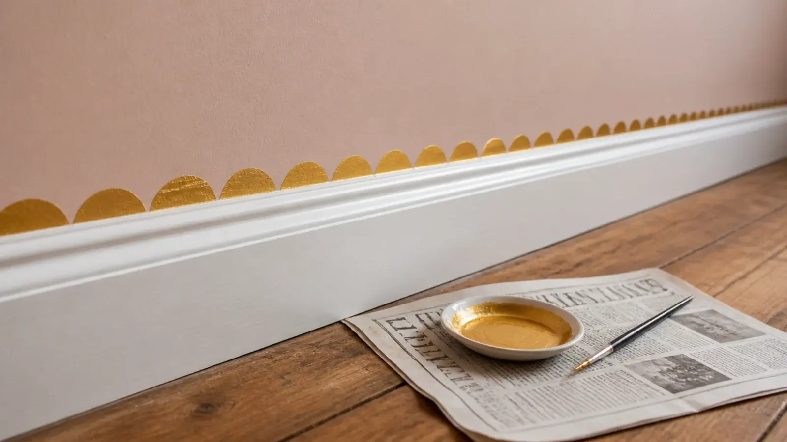 row of small gold scallops painted along the base of a wall