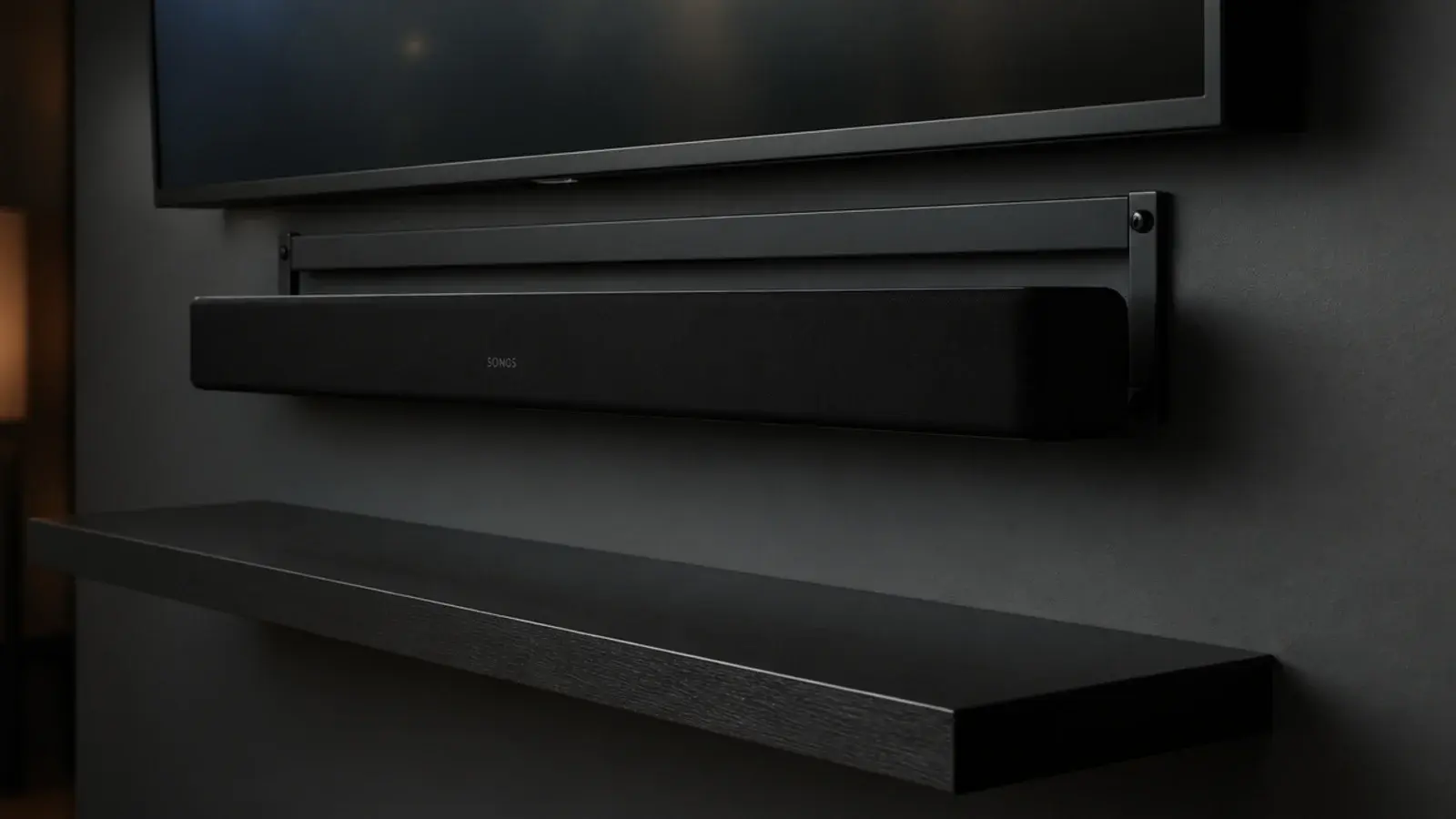 soundbar mounted on a bracket beneath a screen leaving shelves empty