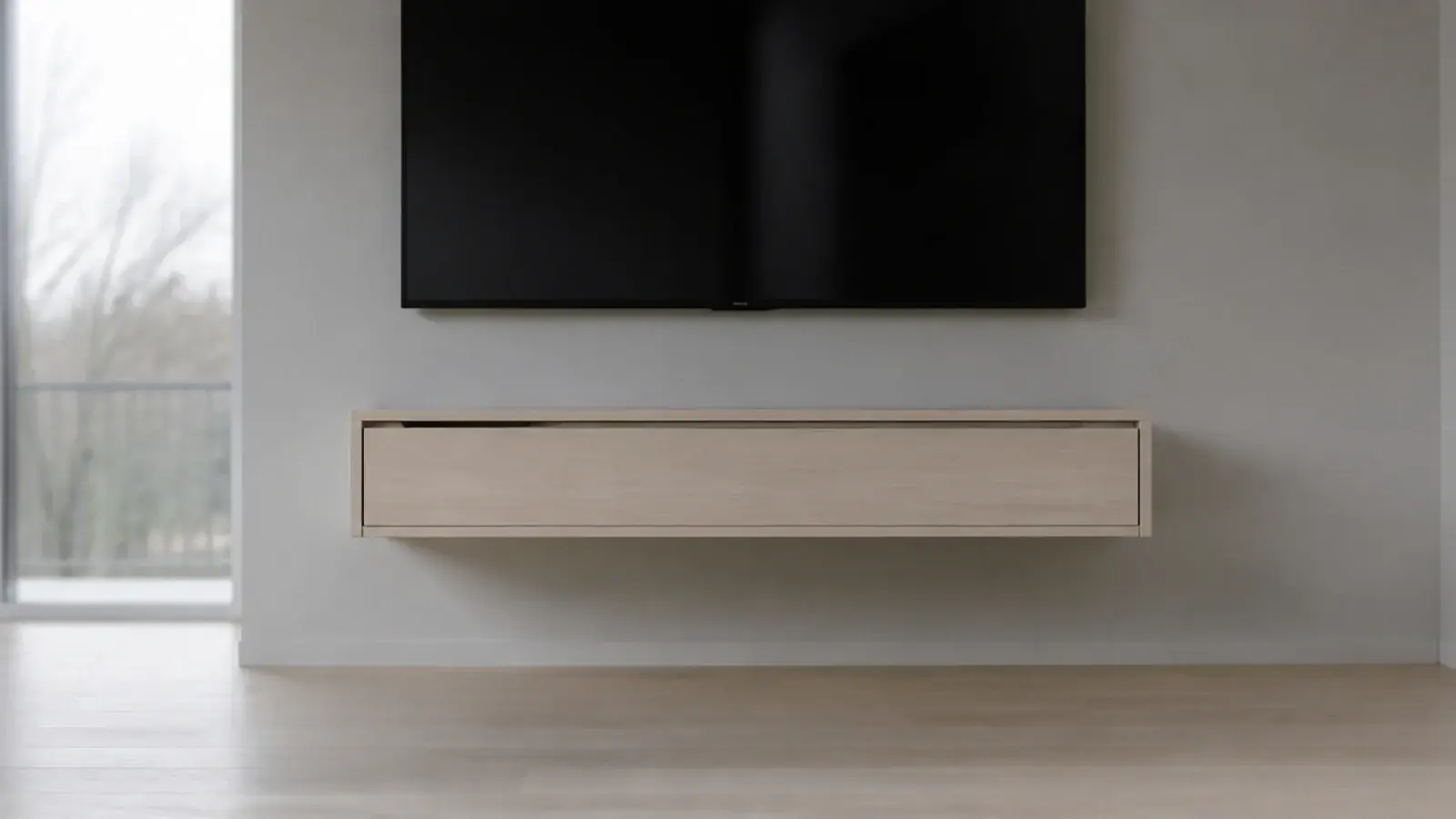 single wall hung drawer floating beneath a screen with clear floor