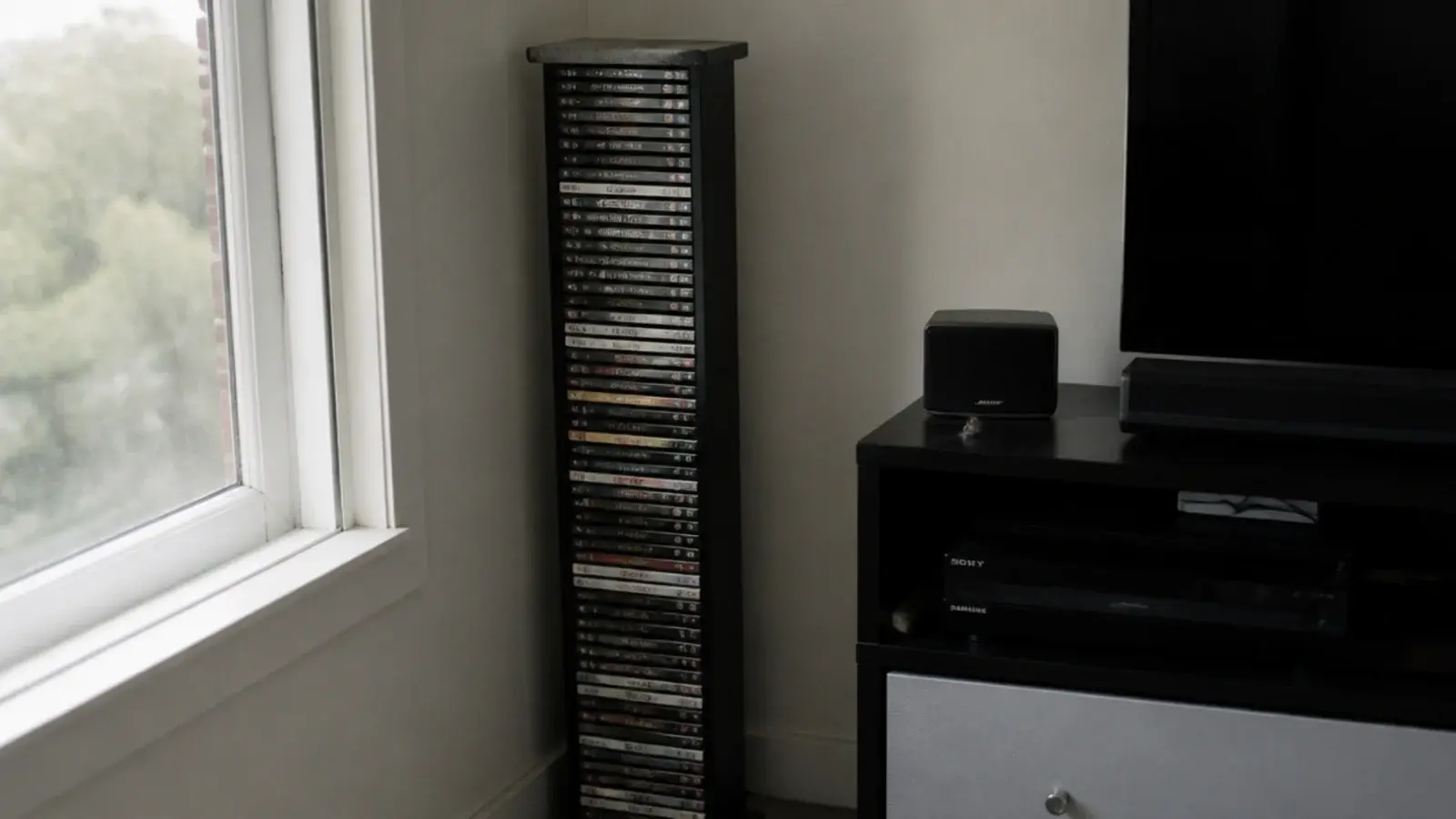 tall disc storage tower crowding the corner beside a media unit