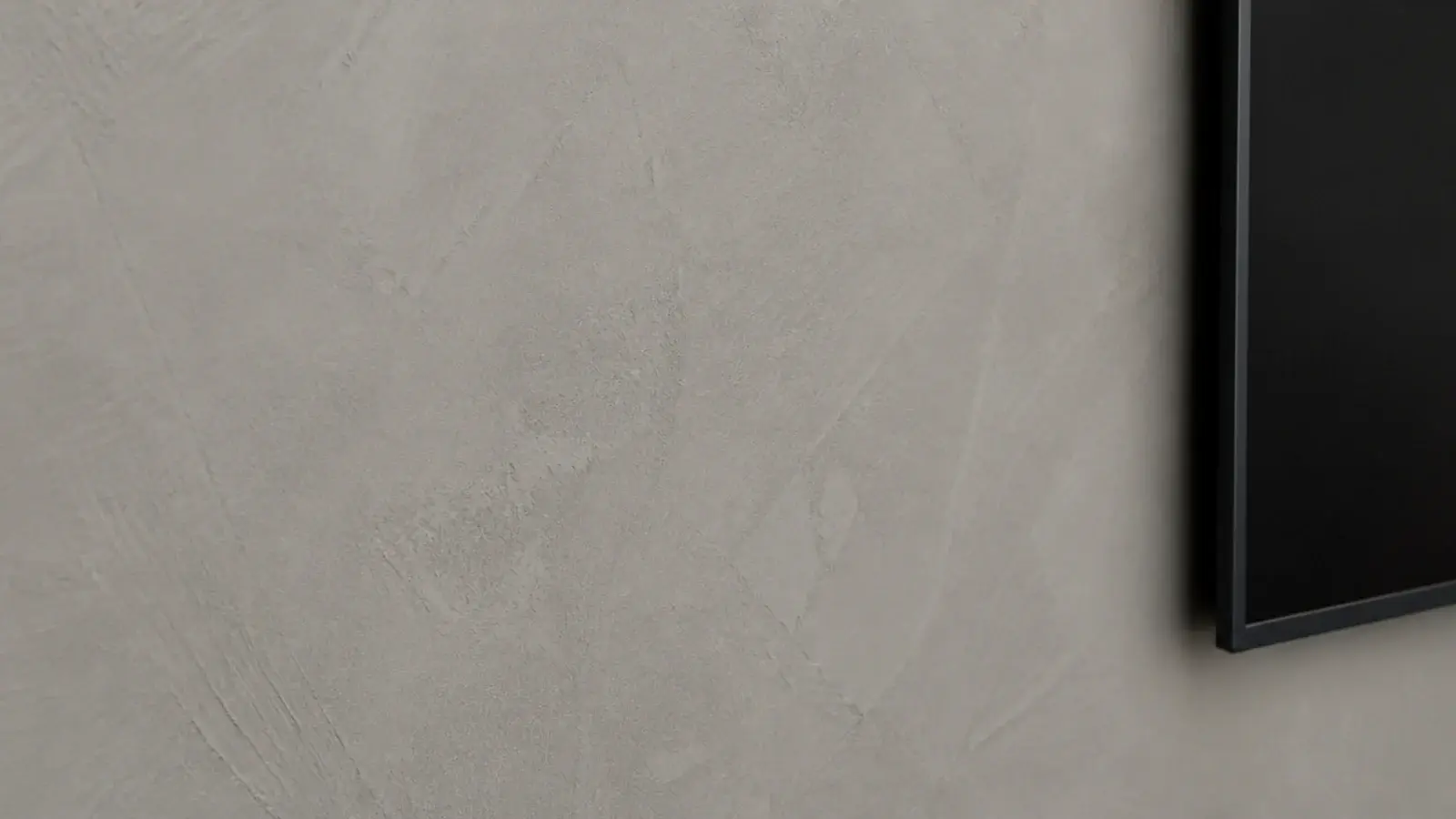 troweled micro cement wall in warm grey with soft mottled movement