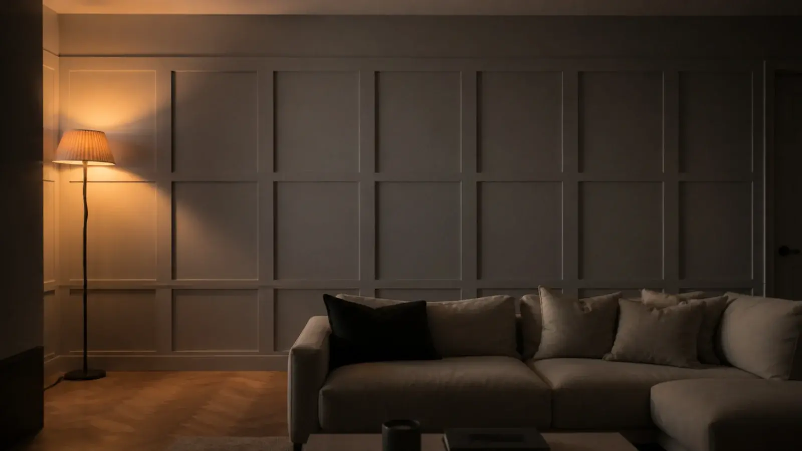 finished living room wall lit low with almost nothing styled on it