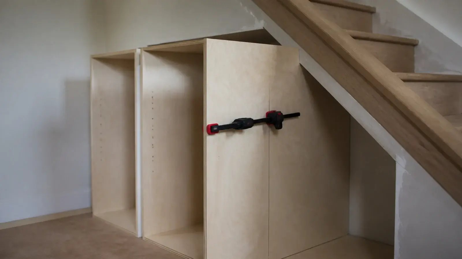 plywood carcass panels dry fitted inside a sloping stair recess