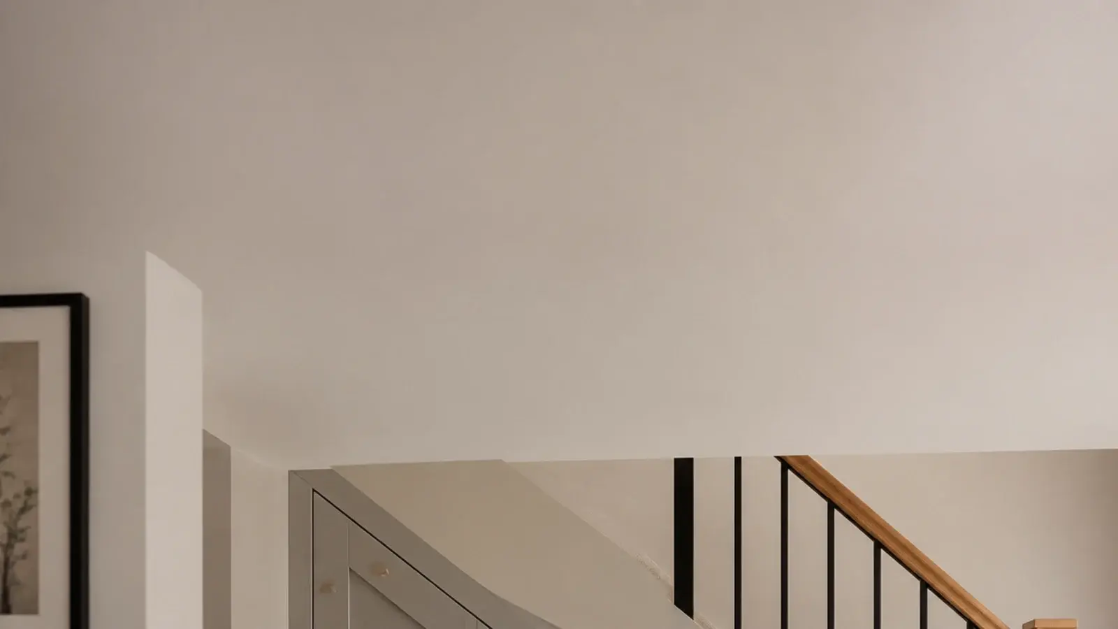 tall view of small under stairs storage planned and fitted with drawers