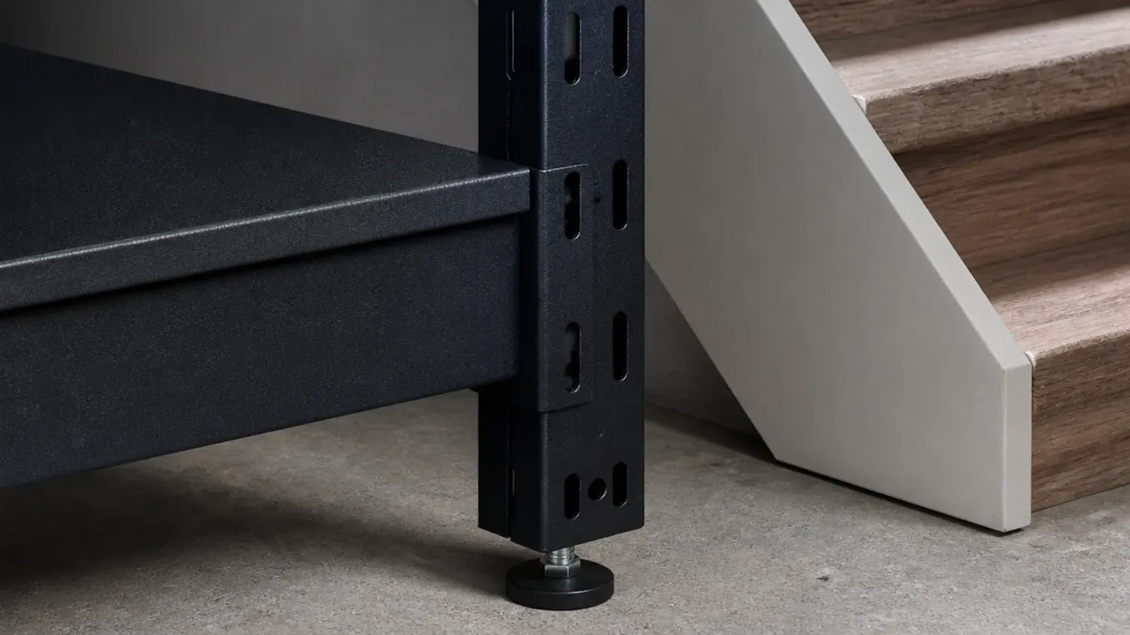 powder coated steel shelving standing against a basement stair wall