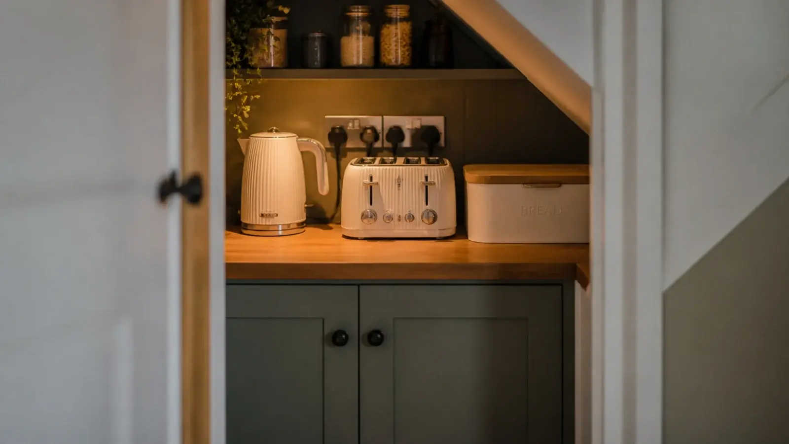 small worktop inside a pantry holding a kettle and toaster