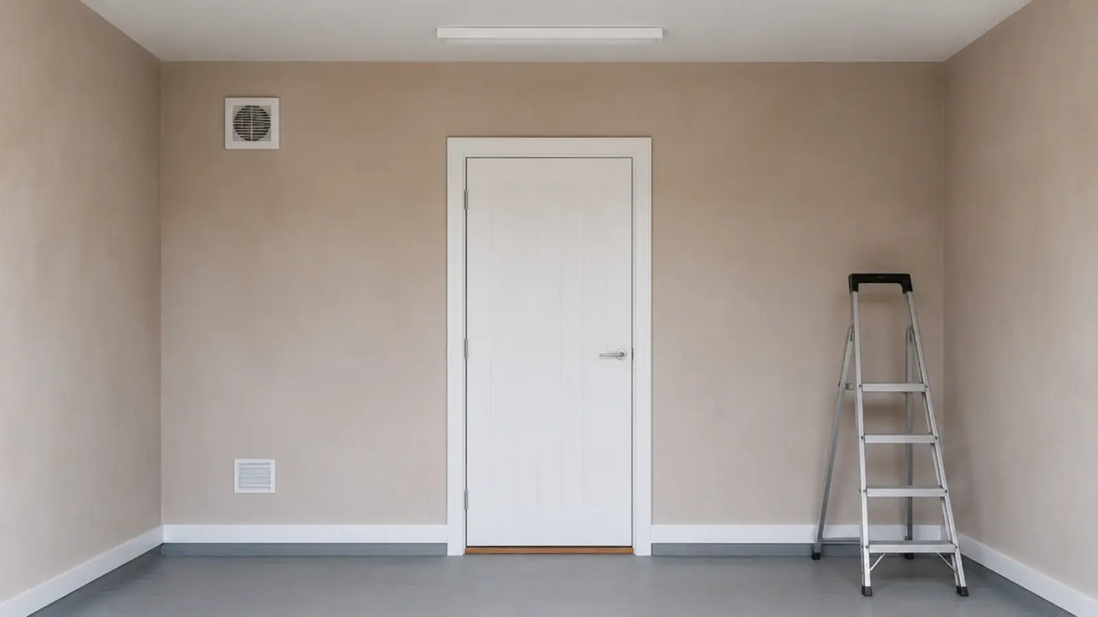 extractor fan set high in a garage wall opposite the internal doorway