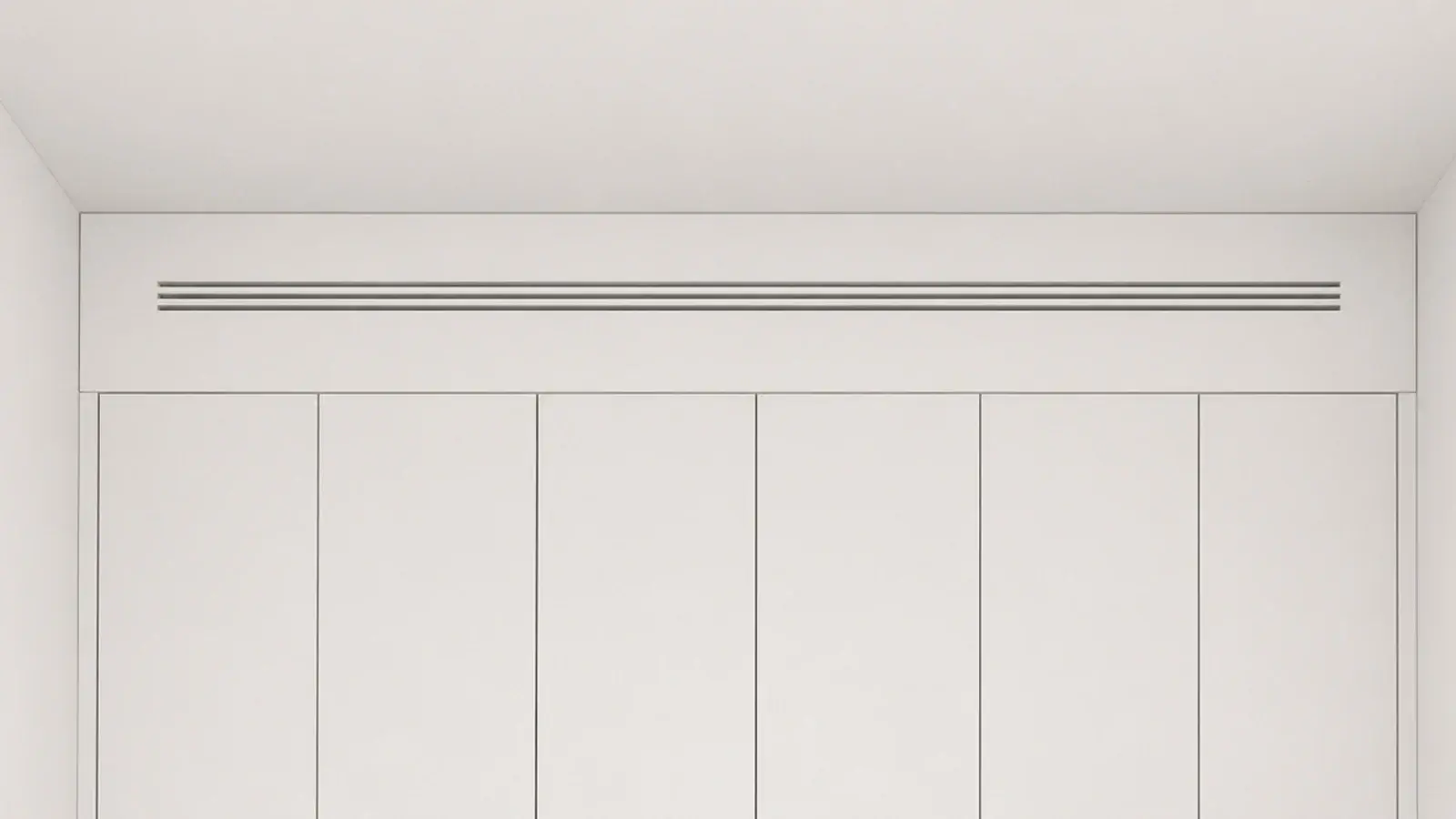 slim linear slot grille painted the wall colour above tall utility cabinets