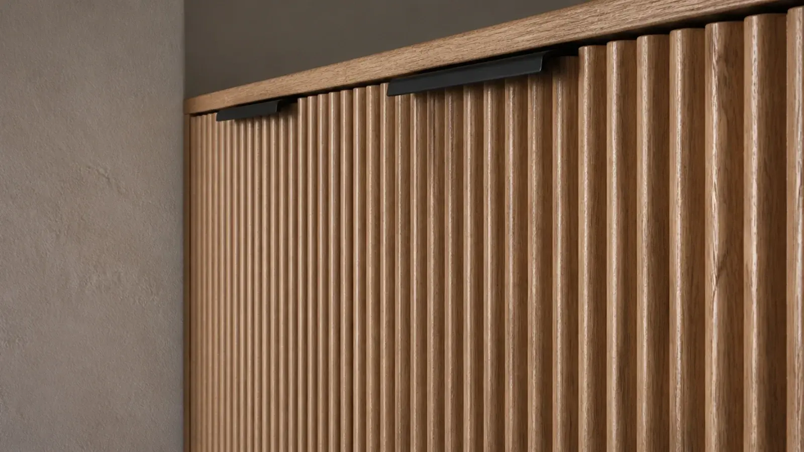 fluted timber cabinet fronts catching light across a modern utility run