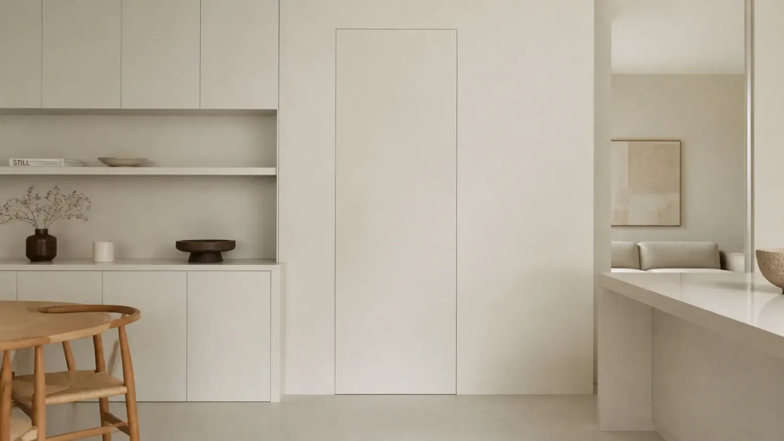 flush jib door painted to disappear into a utility wall of cabinetry