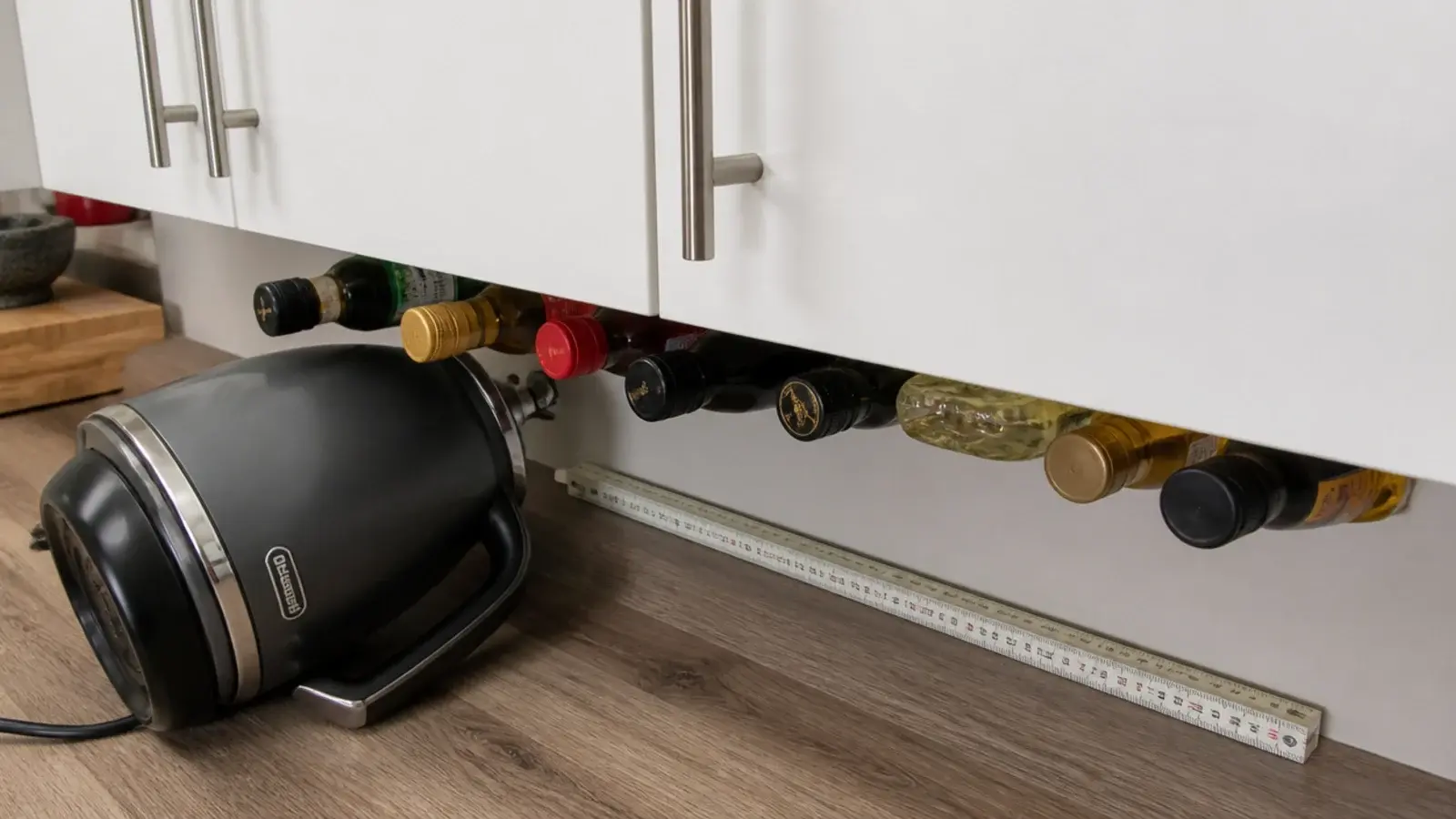 wall cabinets hung too close above a crowded utility worktop