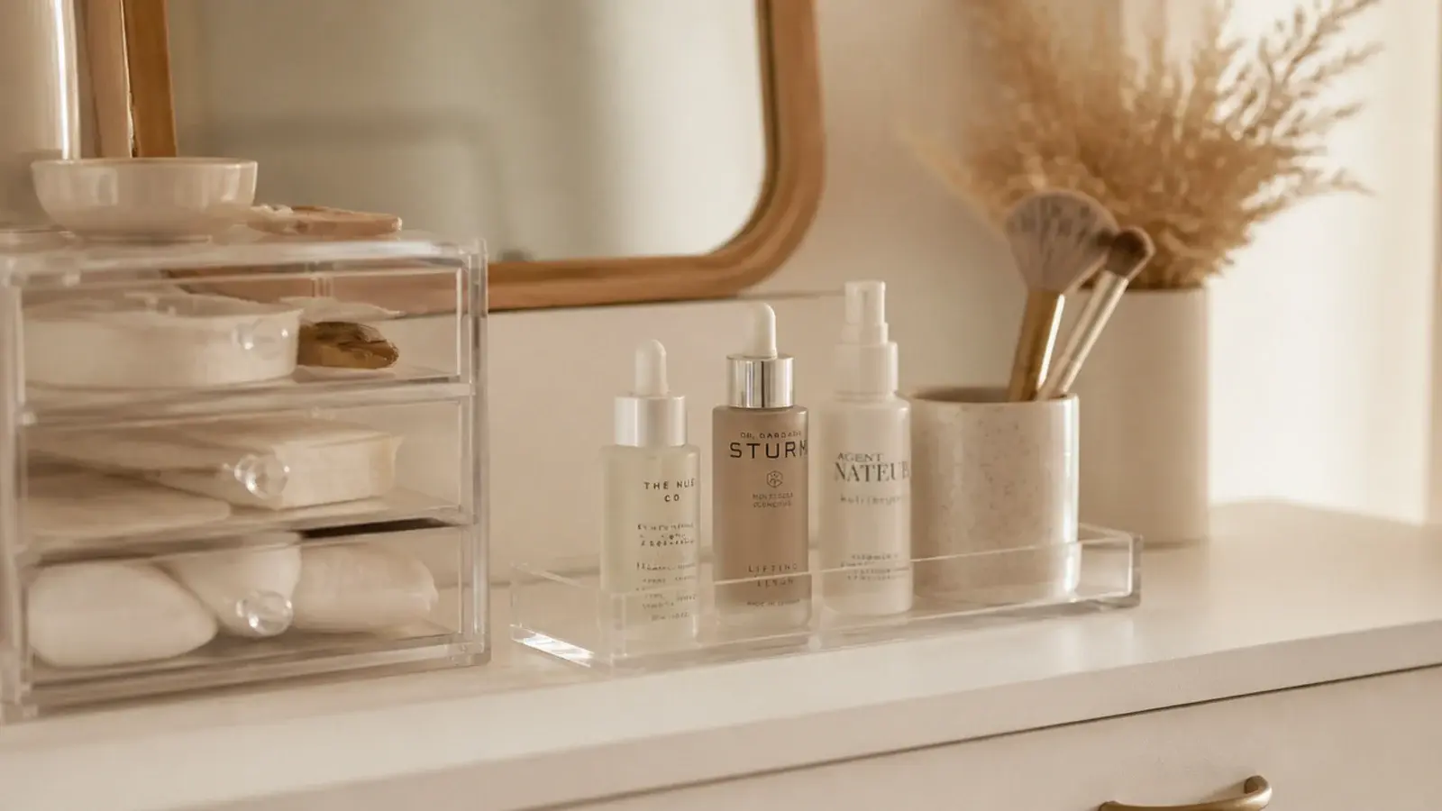 clear acrylic vanity organizers holding brushes palettes and skincare bottles
