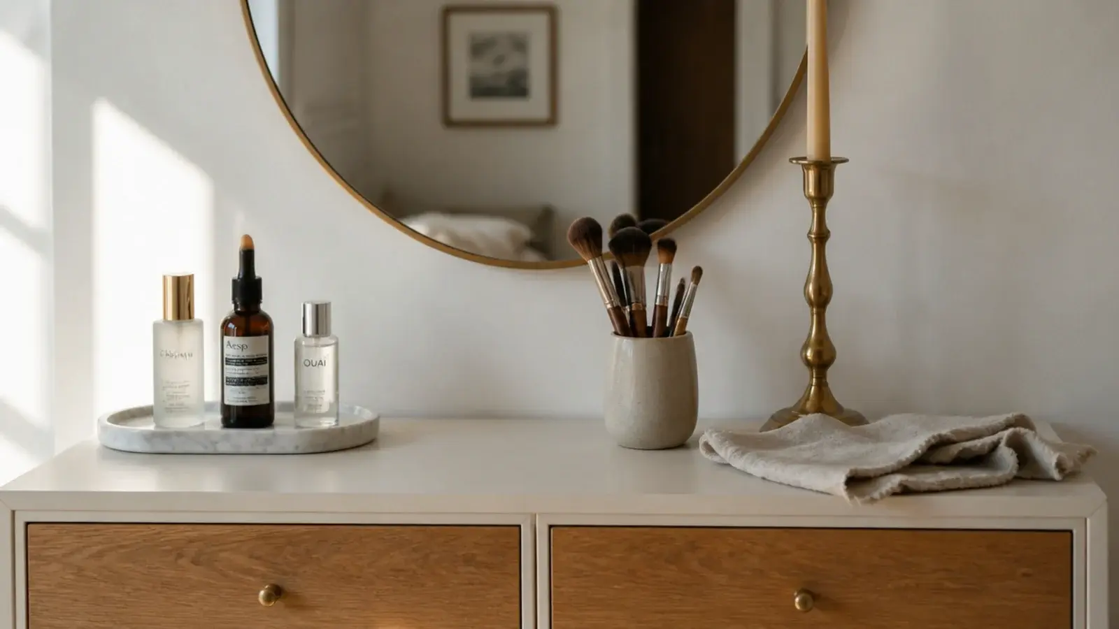 calm cream vanity with tray organization, a brush cup and daily skincare
