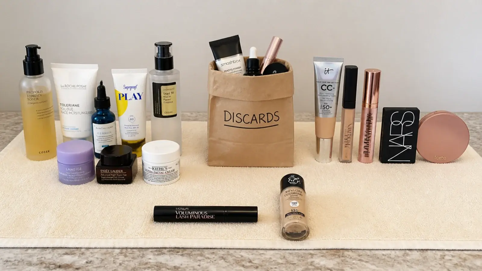 expired products separated from a vanity collection on a towel