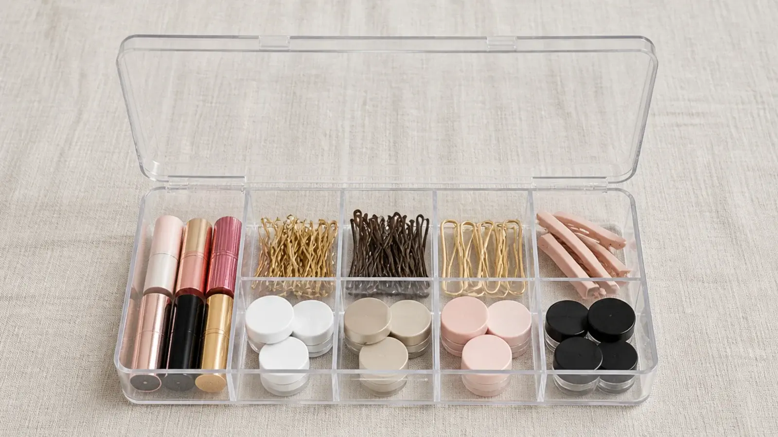 lipsticks and small pots sorted into a compartment bead box