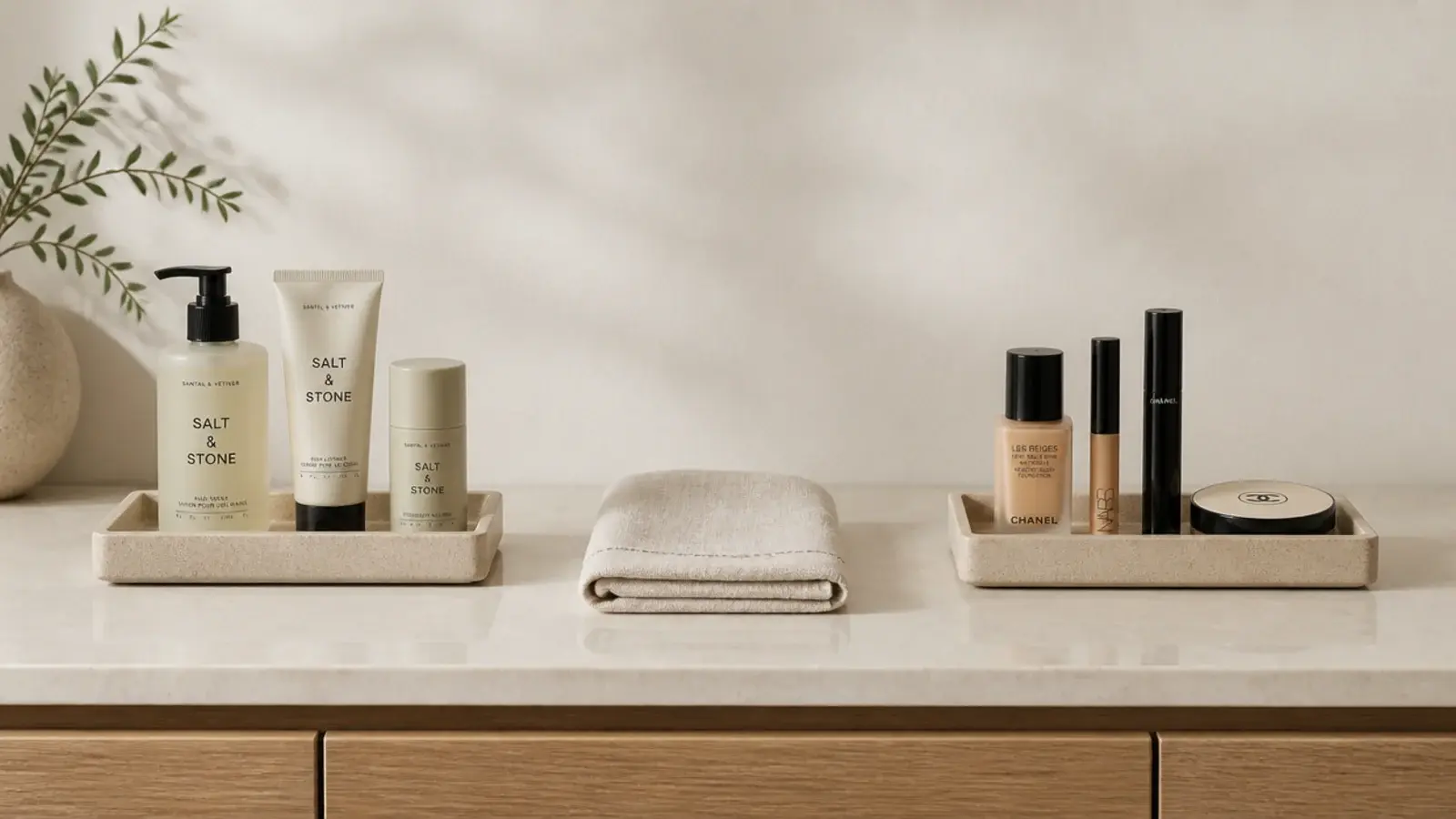 two small trays splitting skincare and makeup on a vanity counter