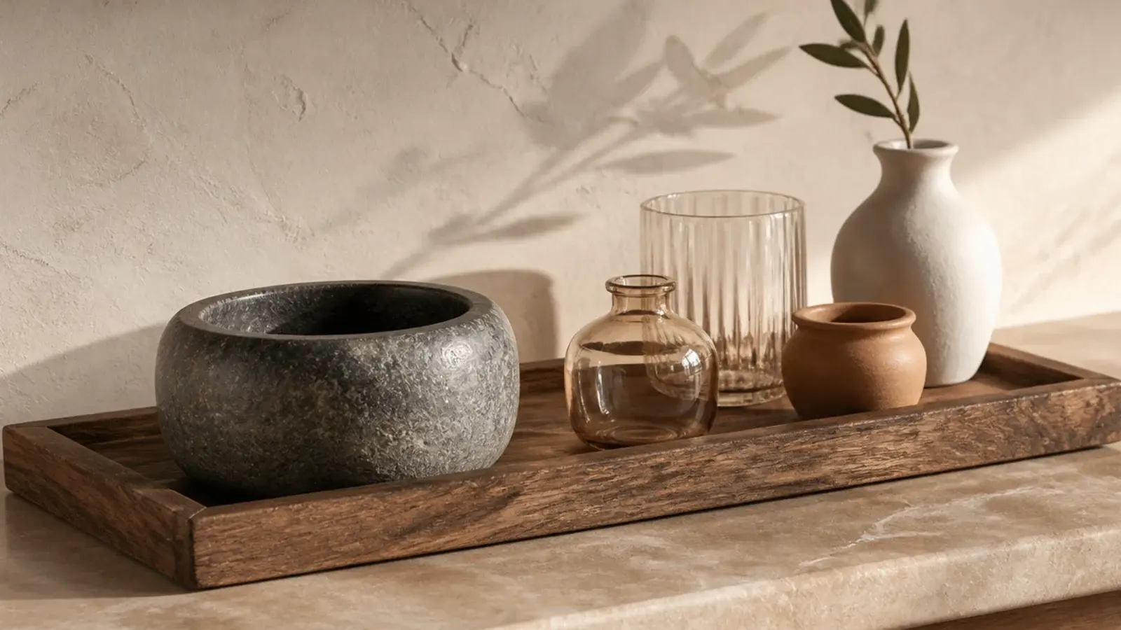 heavy stone object anchoring one end of a vanity tray group