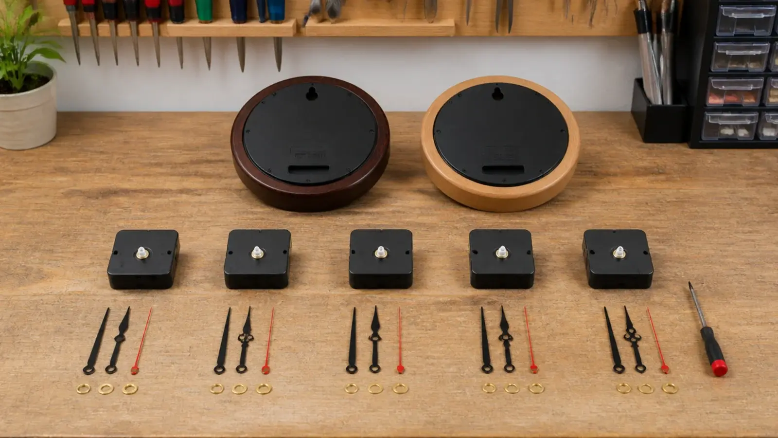 several clock movements laid out on a bench before installation