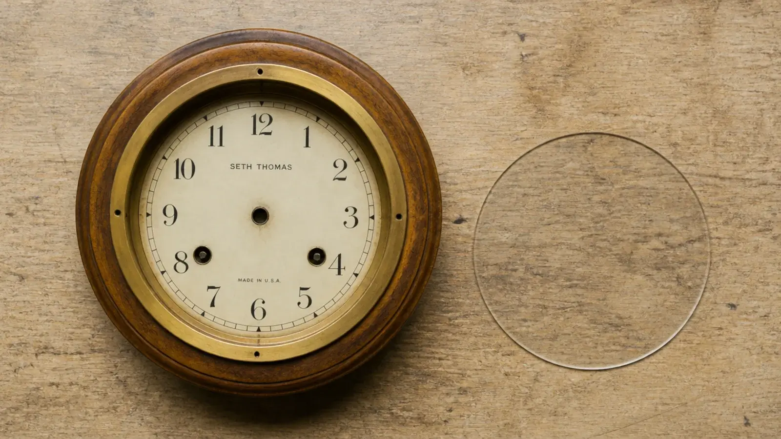 round timber clock case with an empty bezel and no lens