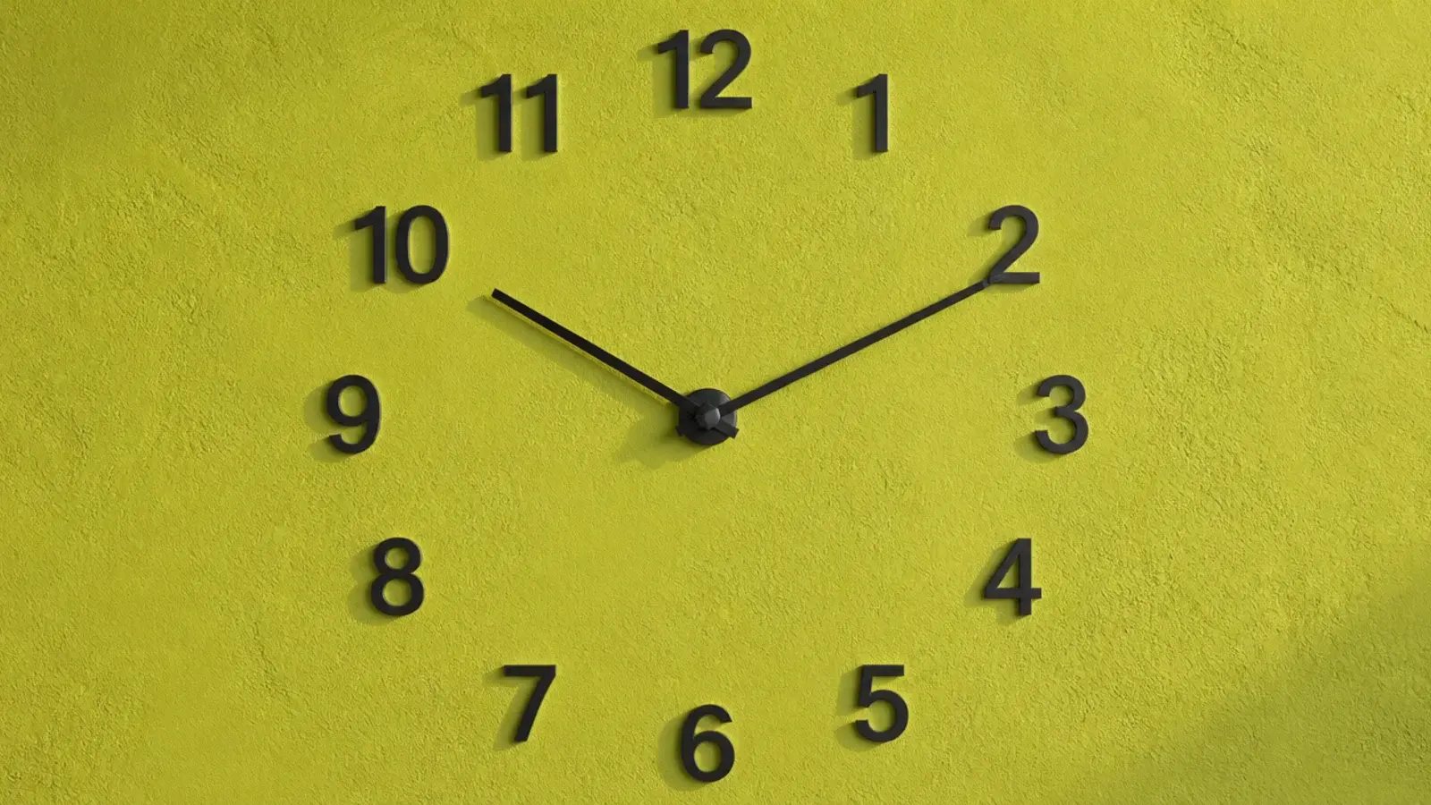 individual metal numerals fixed directly onto a plaster wall