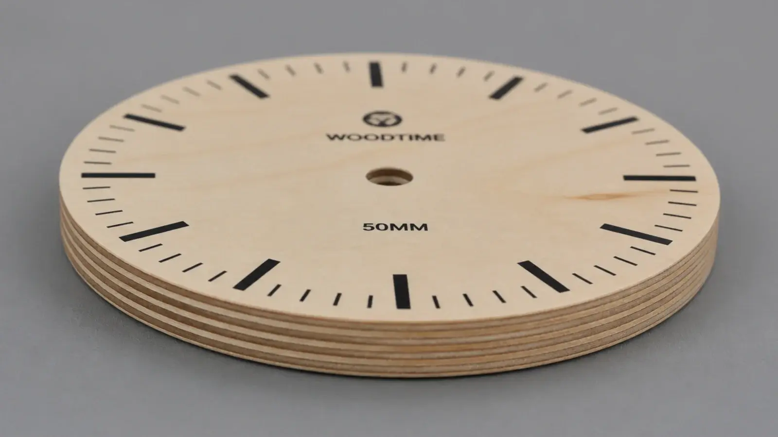 birch plywood clock showing striped laminations around its edge