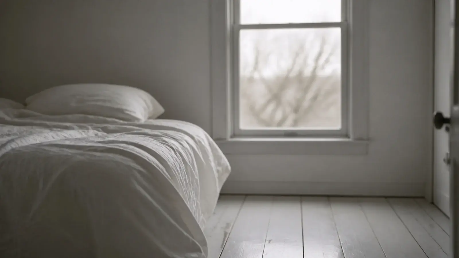 very pale grey washed boards in a dim north facing bedroom
